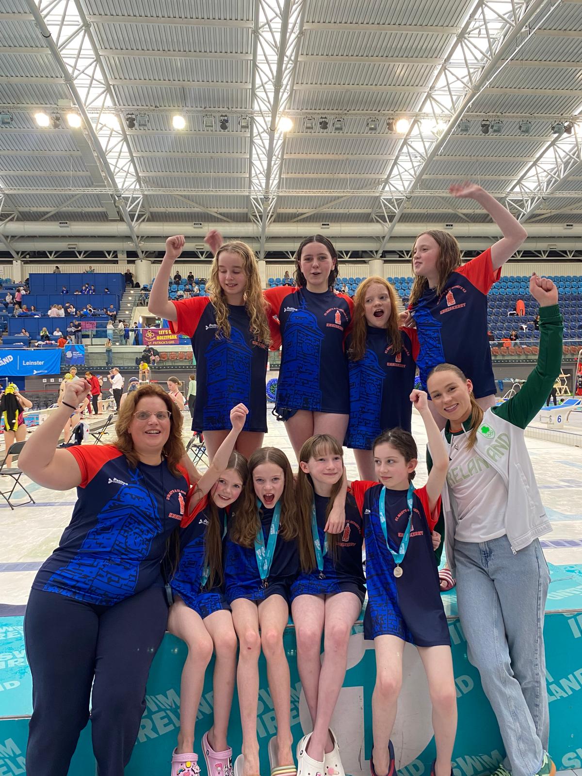 Group shot of swimmers with Ellen