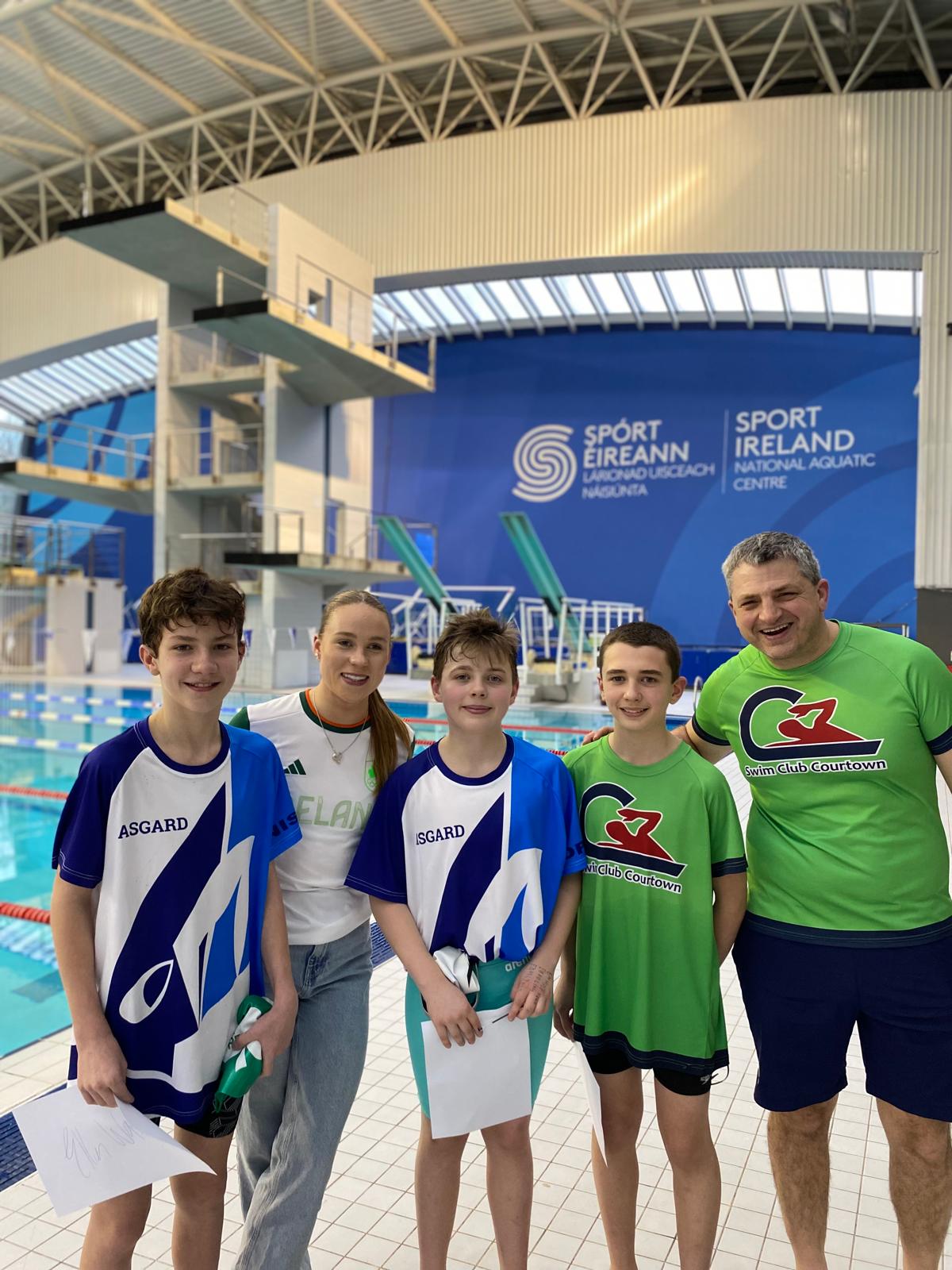 Group shot of swimmers with Ellen