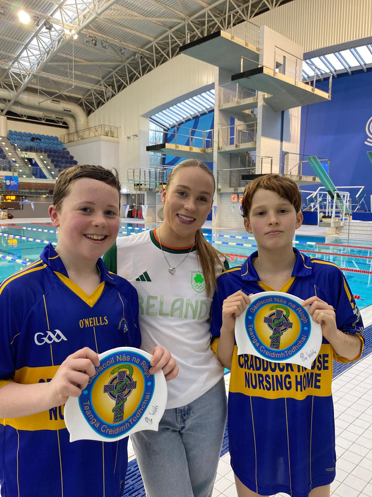 Group shot of swimmers with Ellen