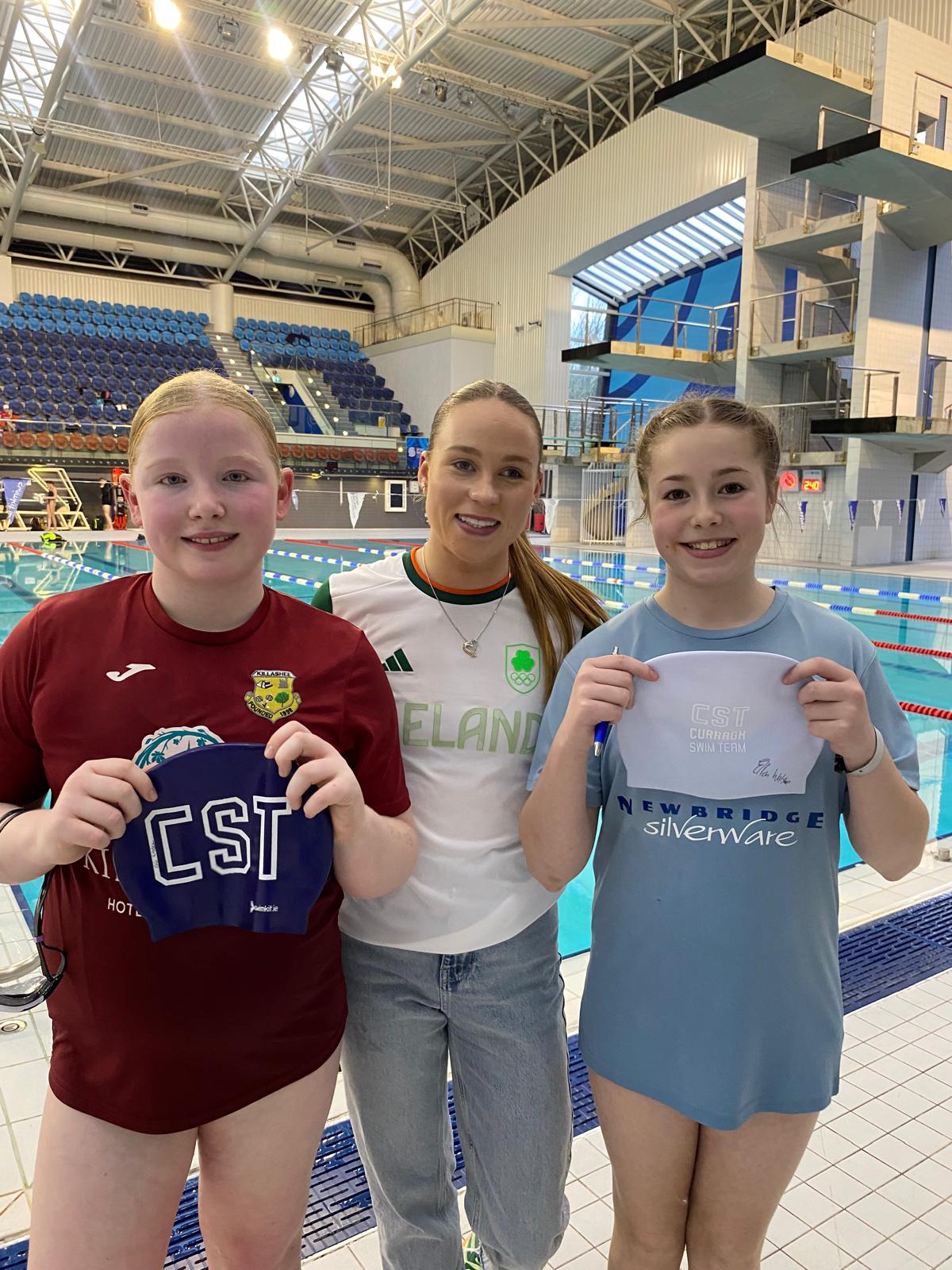 Group shot of swimmers with Ellen