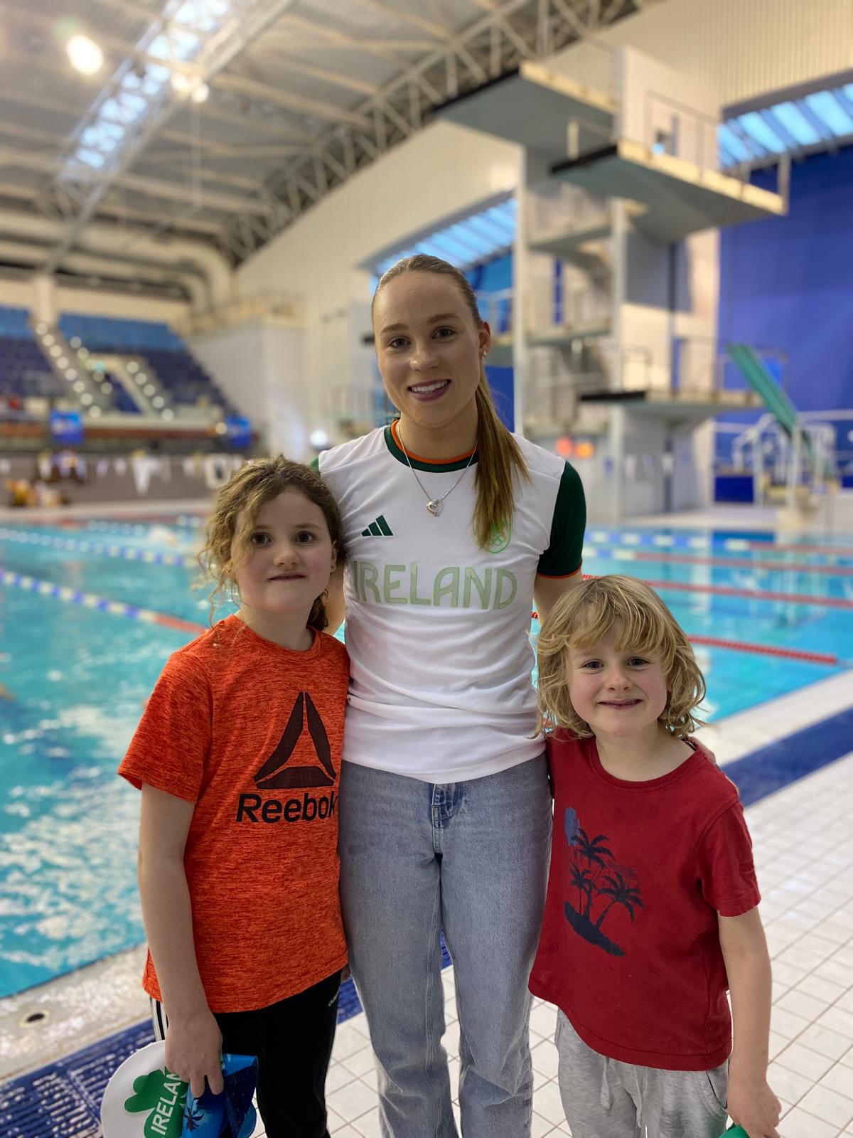 Group shot of swimmers with Ellen