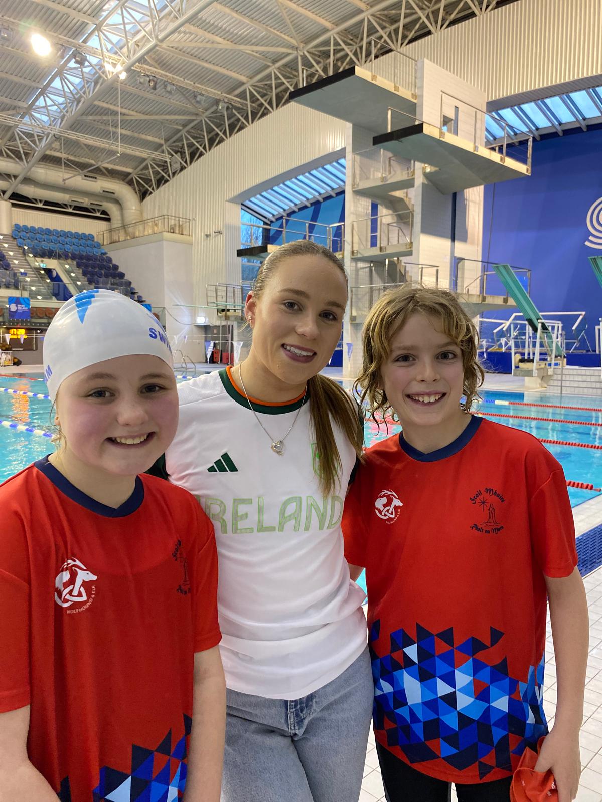 Group shot of swimmers with Ellen
